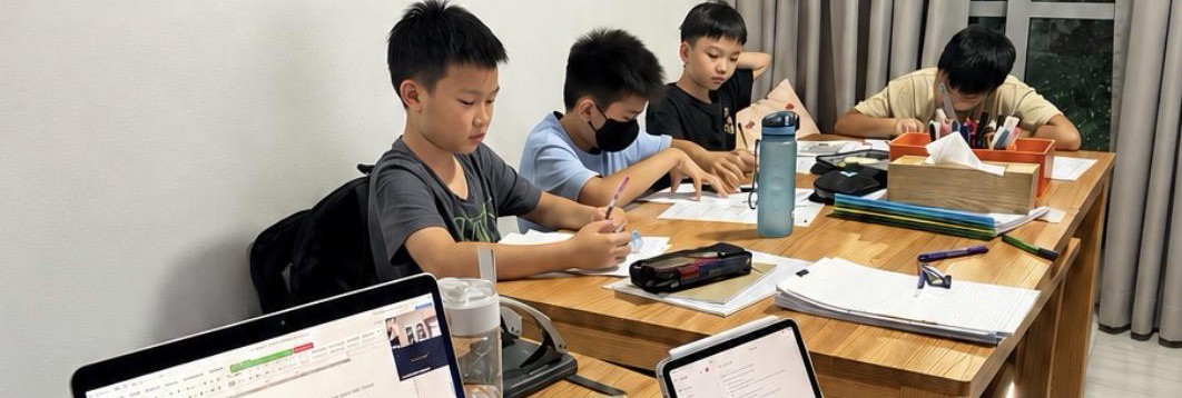 Students working together at a table during class
